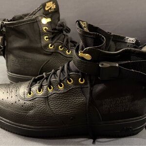 Nike Black High-Top Sneakers with Gold Accents